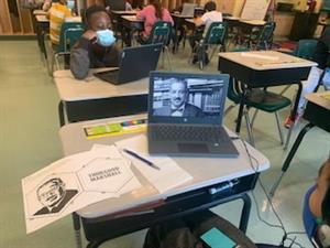 Photo shows laptop displaying research of a student